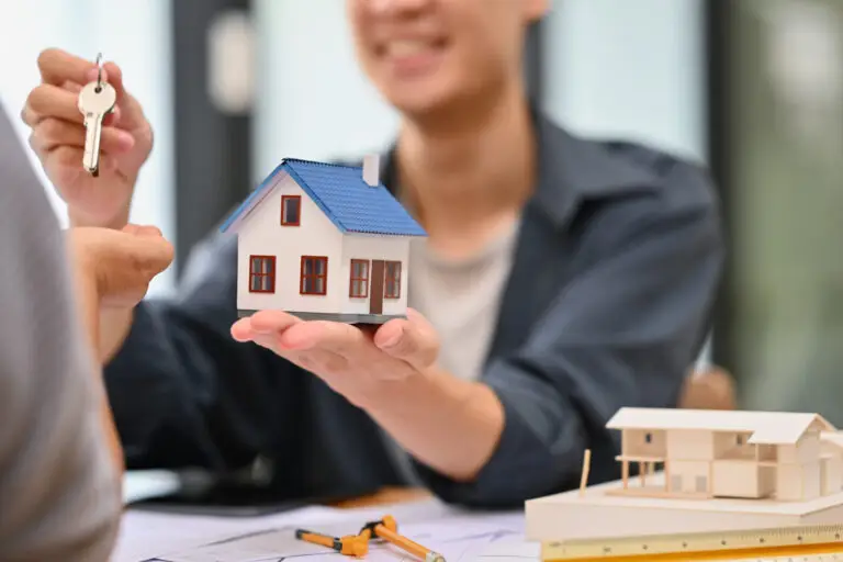 real-estate-agent-sales-manager-giving-keys-to-cl-2023-12-08-05-24-10-utc (1)